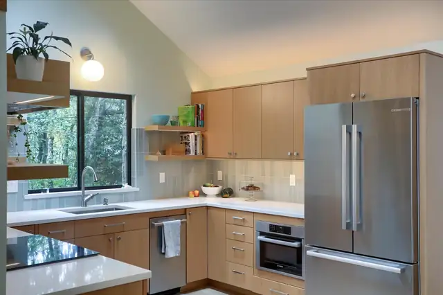 Vancouver, WA kitchen with rift-sawn white oak flat-panel cabinets, floating shelves and white countertops